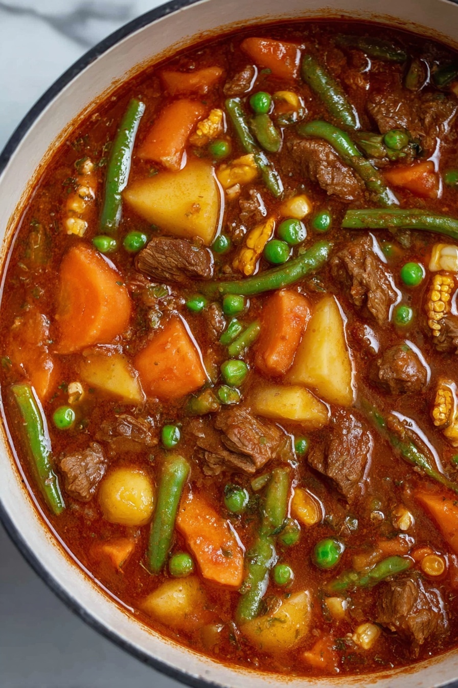 The image shows a large white pot filled with a rich stew. The stew has a thick red-brown sauce with visible chunks of brown meat, bright orange carrot pieces, green beans, yellow corn kernels, and small green peas scattered throughout. The vegetables and meat are mixed evenly, and the top of the stew has a slight shine from the sauce. The pot sits on a white marbled surface, and the inside rim of the pot shows some sauce stains. Photo taken with an iphone --ar 2:3 --v 7