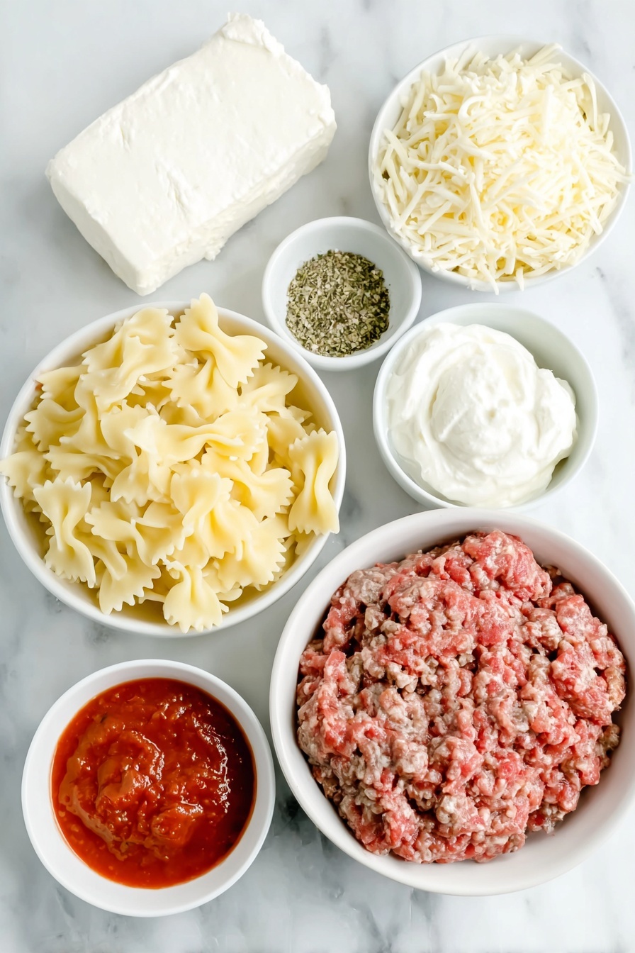 Flat lay of lean ground beef, a block of cream cheese softened, a dollop of sour cream, a scoop of ricotta cheese, small white bowl of mixed Italian seasoning, small white bowl of garlic powder, two small white bowls of marinara sauce, a small white bowl filled with water, uncooked bowtie (farfalle) pasta, a mound of shredded mozzarella cheese, all arranged with perfect symmetry on simple white ceramic bowls and plates, placed on a clean white marble surface, soft natural light, photo taken with an iPhone, professional food photography style, fresh ingredients, white ceramic bowls, no bottles, no duplicates, no utensils, no packaging --ar 2:3 --v 7 --p awthu7i m7354615311229779997
