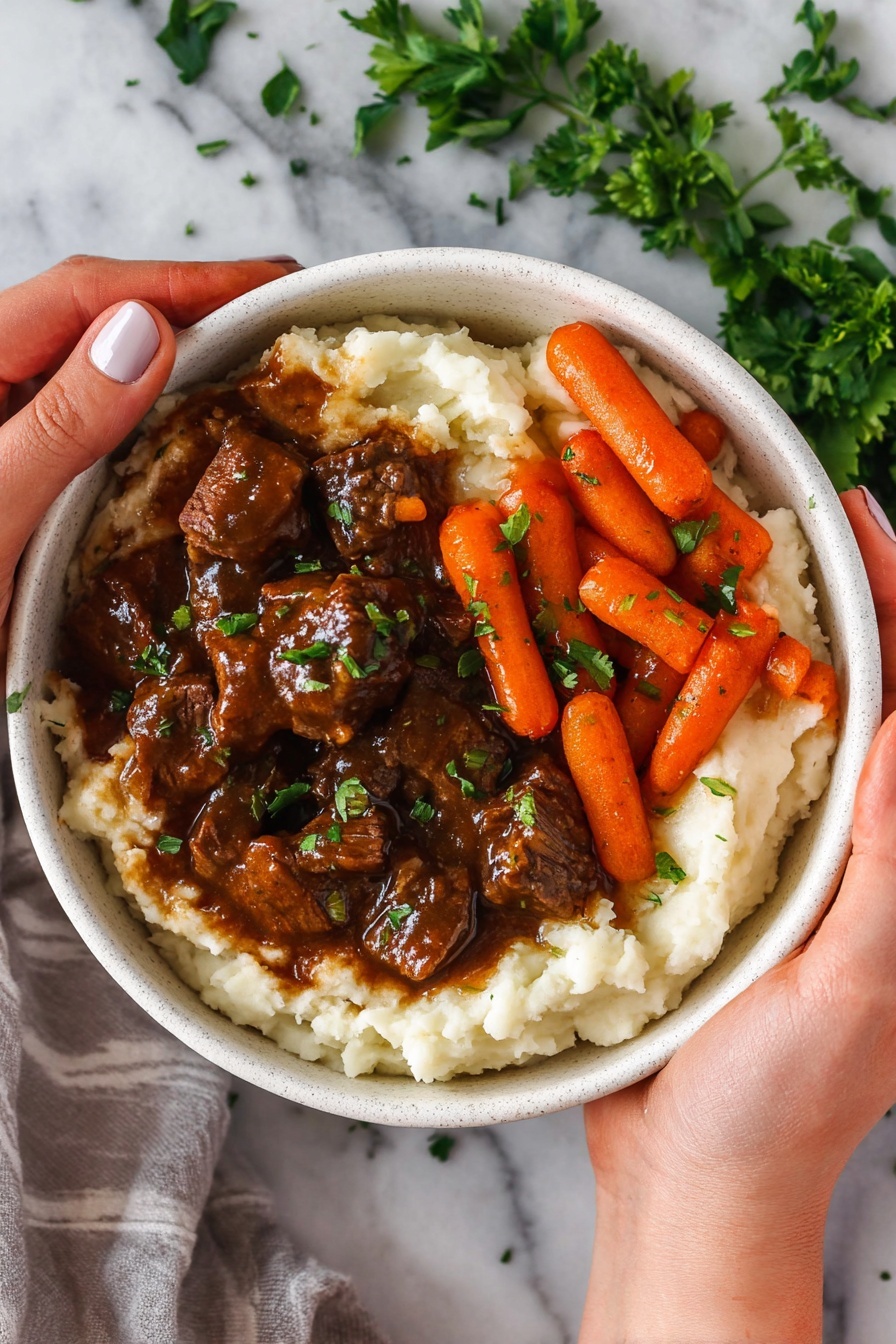 A close-up top view of a silver metal pan with small pieces of browned beef scattered inside. The beef pieces vary in size and shape, showing a mix of light brown seared surfaces and pink, uncooked areas. The pan has some brown oil and cooking marks, with steam rising from the meat. The pan handle is visible on the left and bottom right sides. The pan rests on a white marbled surface. photo taken with an iphone --ar 2:3 --v 7
