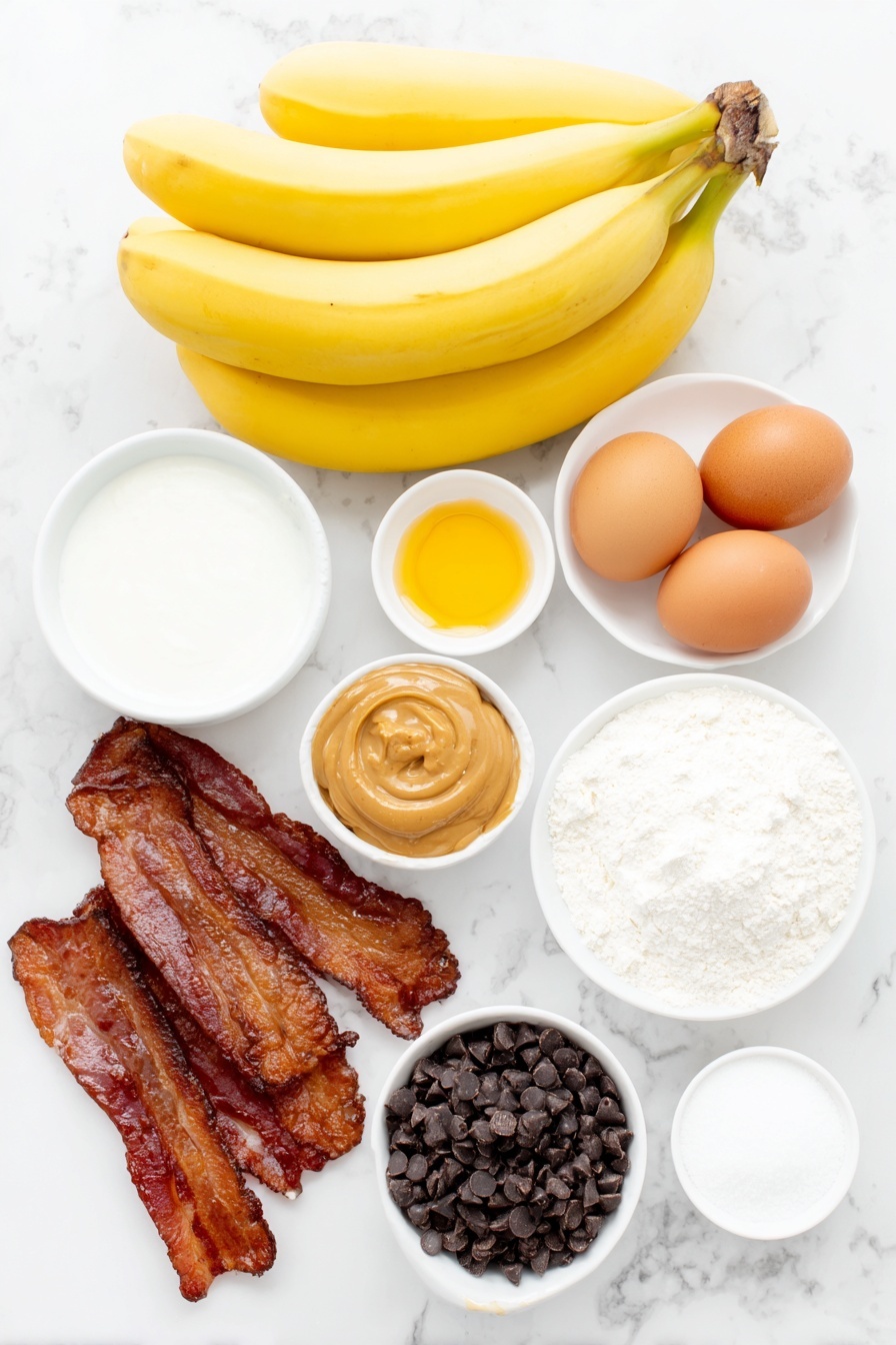 Flat lay of ripe yellow bananas, two whole brown eggs with clean shells, a small white bowl of glossy chocolate chips, a small white bowl of light brown sugar, a small white bowl of granulated sugar, a small white bowl of all-purpose flour, a small white bowl of baking soda, a small white bowl of fine salt, a small white bowl of golden vegetable oil, a small white bowl of creamy full-fat sour cream, a small white bowl of smooth creamy peanut butter, a small white bowl of amber honey, a small white bowl of white powdered sugar, uncooked raw bacon strips arranged neatly on a simple white ceramic plate, placed on a clean white marble surface, soft natural light, photo taken with an iPhone, professional food photography style, fresh ingredients, white ceramic bowls, no bottles, no duplicates, no utensils, no packaging --ar 2:3 --v 7 --p m7354615311229779997